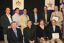 A dozen University of Scranton faculty members were honored for their contributions toward enhancing the University community. Seated from left are: Harold Baillie, Ph.D., provost and senior vice president for academic affairs; Kevin P. Quinn, S.J., president; Gretchen J. Van Dyke, Ph.D., associate professor of political science; and Anthony Ferzola, Ph.D., associate professor and chair of the Mathematics Department. Standing are Nabil A. Tamimi, Ph.D., professor and chair of the Operations Management Department;  James C. Roberts, Ph.D., associate professor of sociology and criminal justice; Jordan Petsas, Ph.D., associate professor and chair of the Economics and Finance Department; George J. Aulisio, assistant professor in the Weinberg Memorial Library; Will T. Cohen, Ph.D., assistant professor of Theology and Religious Studies; and John McGrath, adjunct professor of education in the Panuska College of Professional Studies