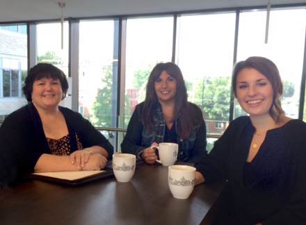 Representatives from The University of Scranton’s Women’s Entrepreneurship Center and the SBDC meet with former small business owner, Andrea Mulrine, to plan for the upcoming “Coffee and Confidence,” a free information session on Sept. 23 for women with lower incomes interested in learning about self-employment. From left are Mulrine of Scranton, Francene Pisano Dudziec of Moosic, special projects coordinator at the University’s SBDC, and student intern Olivia Levine ’16 of Simpson.