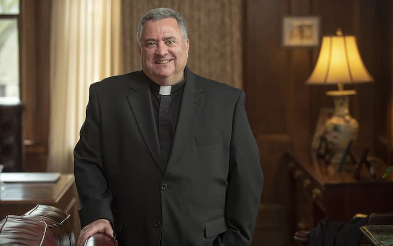 A portrait of President Father Marina