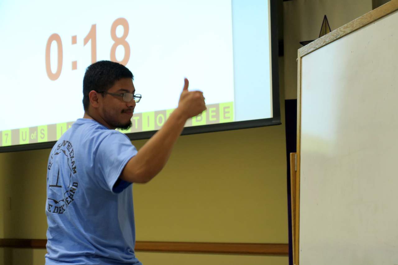 A male student showing thumbs up during the 2017 Integration Bee