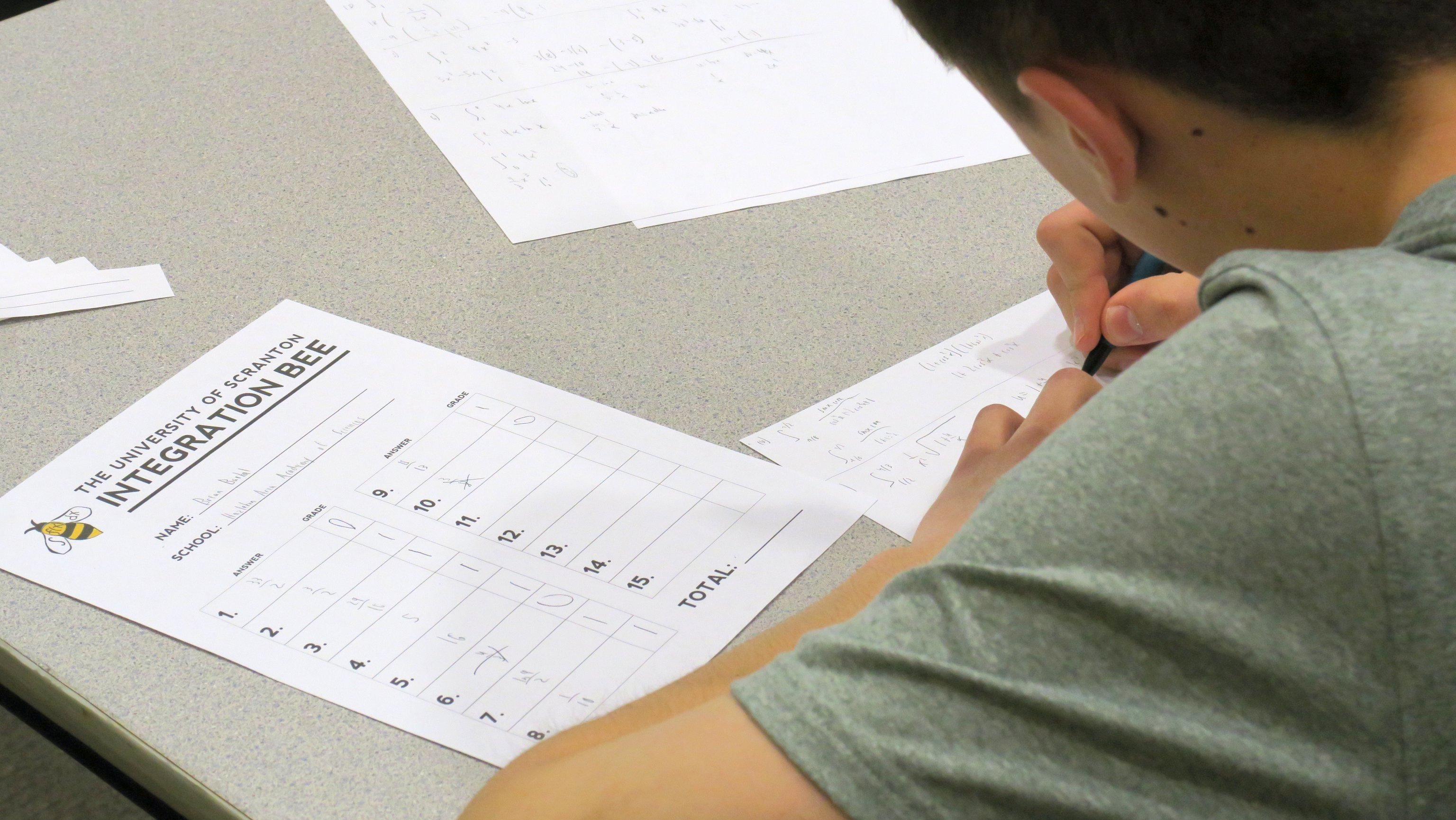 A Hazelton Area Academy of Sciences student solving a definite integral by substitution during the 2019 Integration Bee