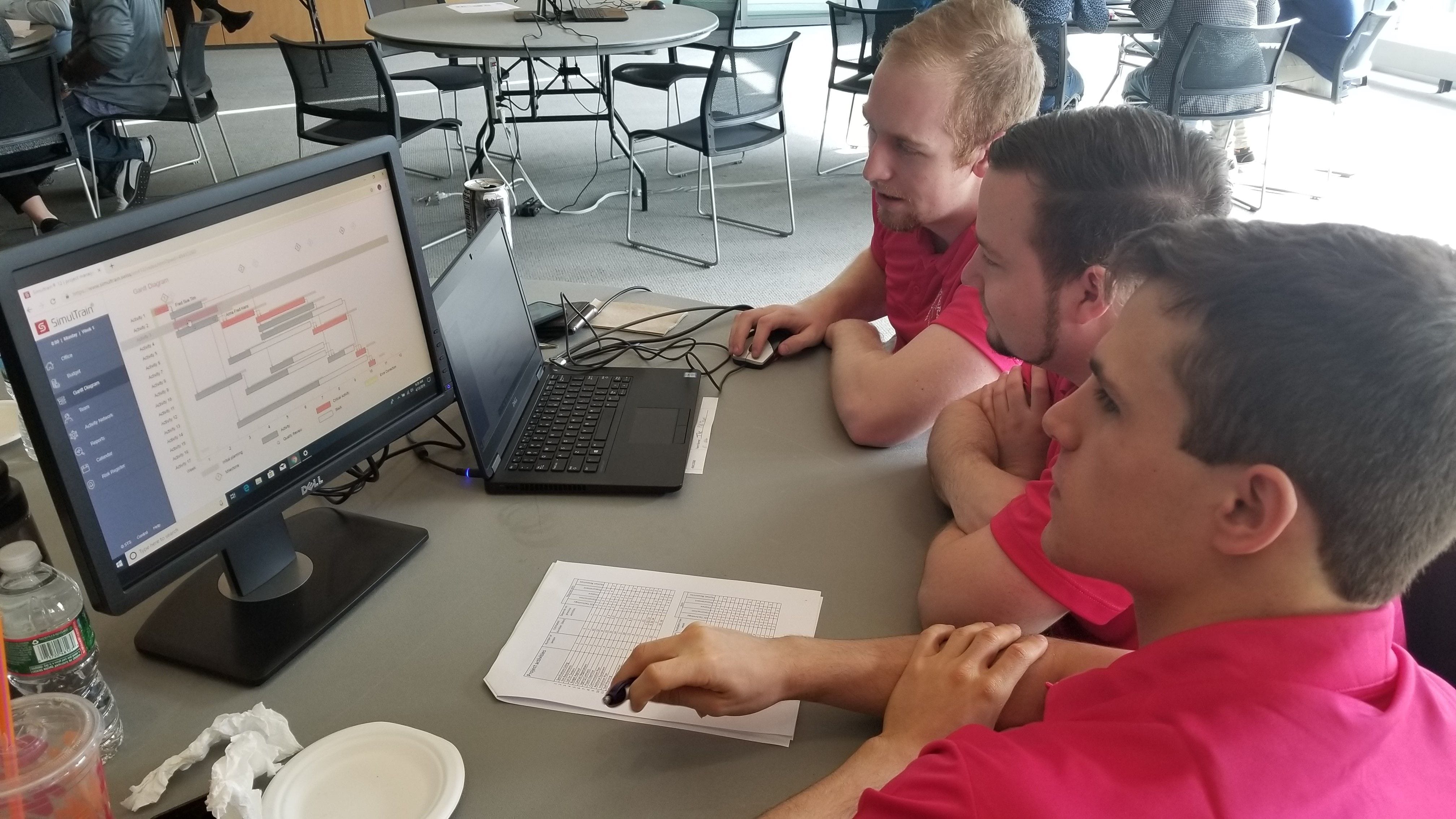 Students solving an issue at a table