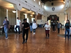 Dancers led by Spanish instructor