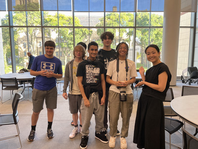 Japanese instructor Naoko Omori standing with five of her Japanese students at the Anime event.