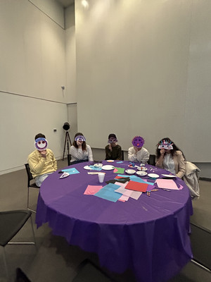 A group of students wearing Mapuche masks that they made. 