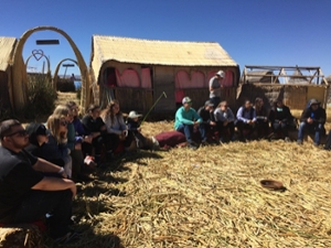 Students sitting on ground in Peru 