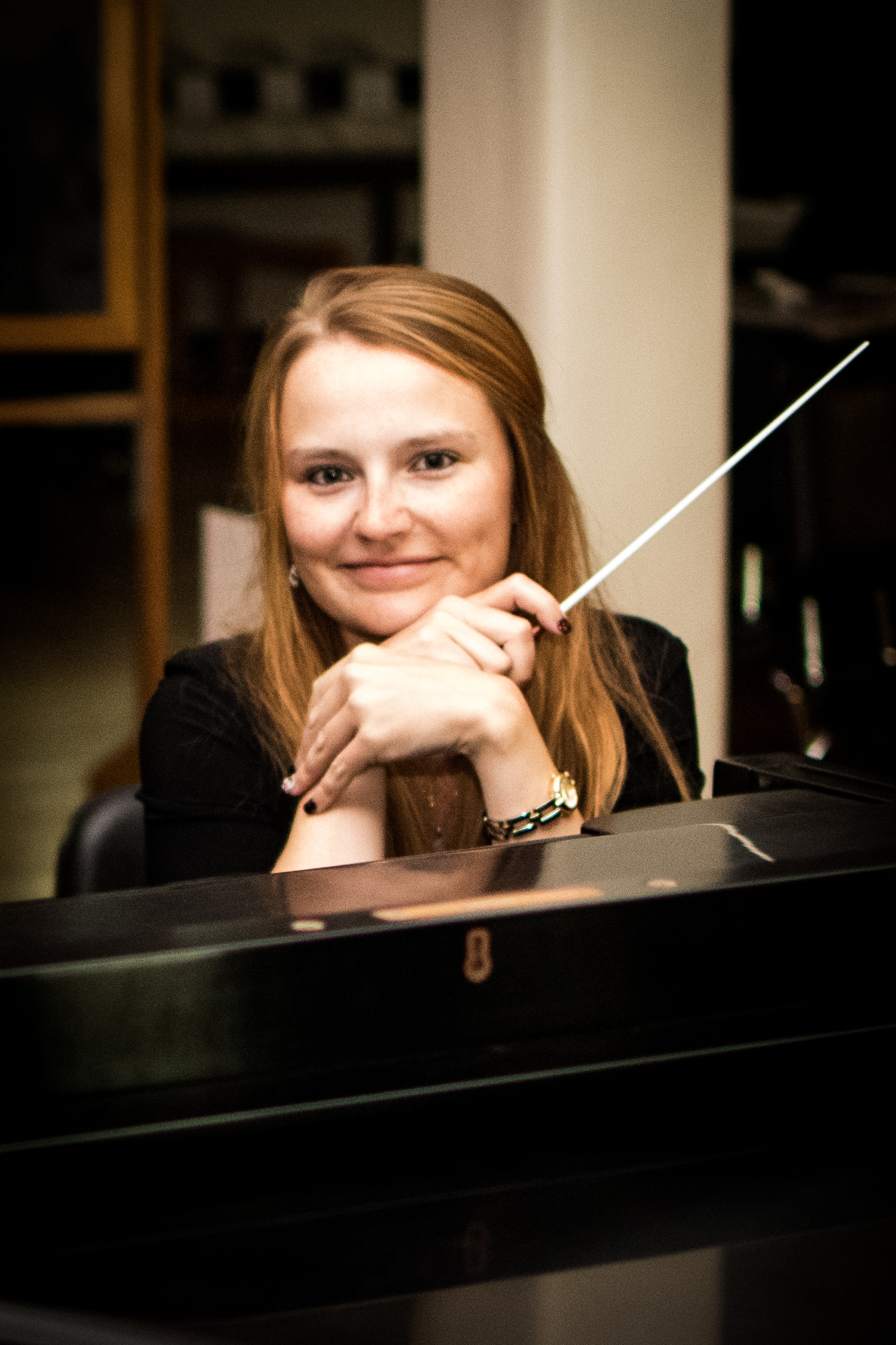 Headshot of Janelle Decker, Conductor & Co-Director