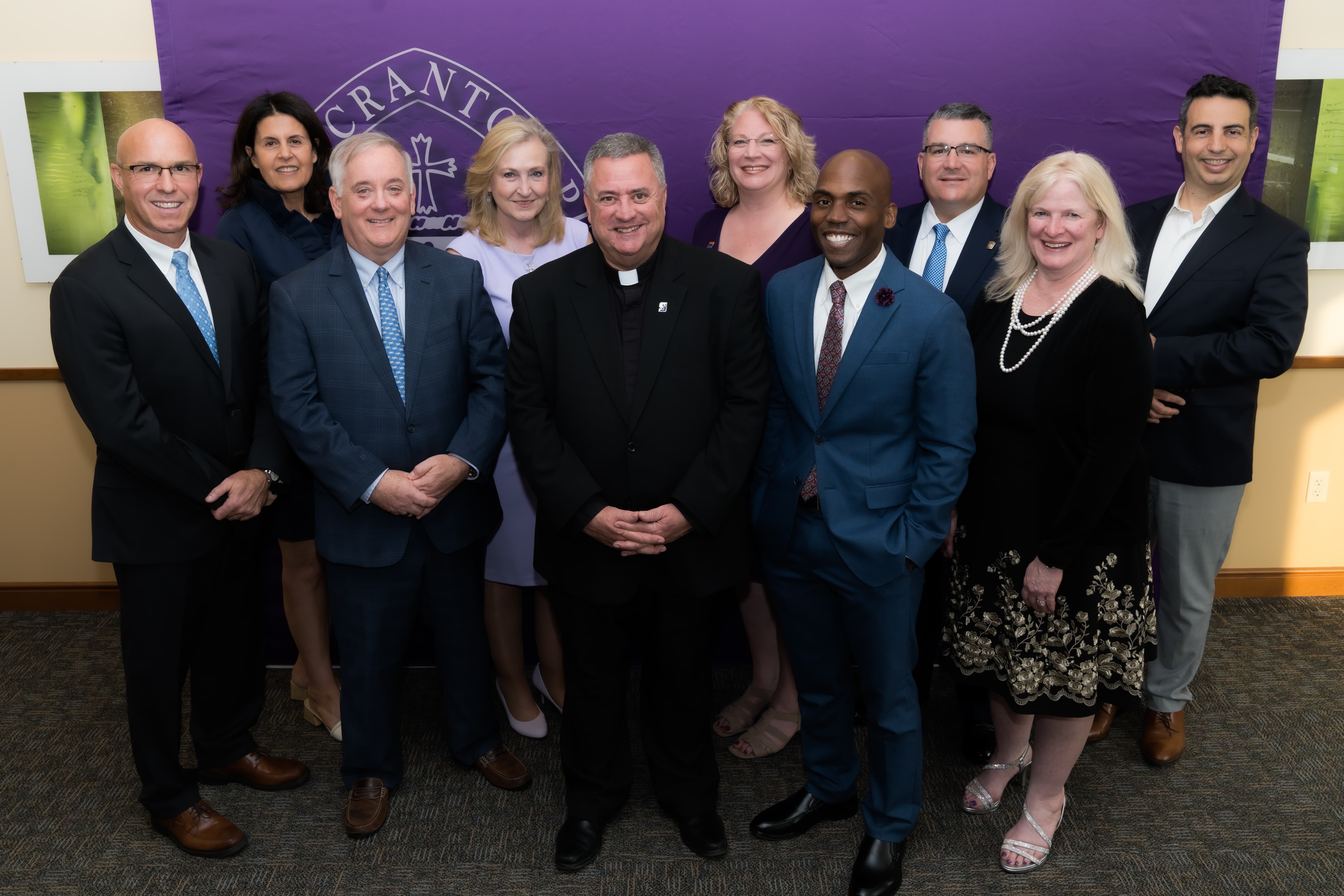 From left, Matthew L. Davidson, Ph.D. '93, P'24, Noradeen Farlekas, LP.D., CFA '83, John J. (Jack) Lynch III '83, Colleen A. Joseph, M.D. '83, Rev. Joseph G. Marina, S.J., University President, Linda Mathias Hee, Esq. '93, Yohuru R. Williams, Ph.D. '93, G'93, Col. Christopher L. Paris, Esq. '98, Erin Tracy Bradley, M.D., MPH '88, and Paul DiPietrantonio '97, 