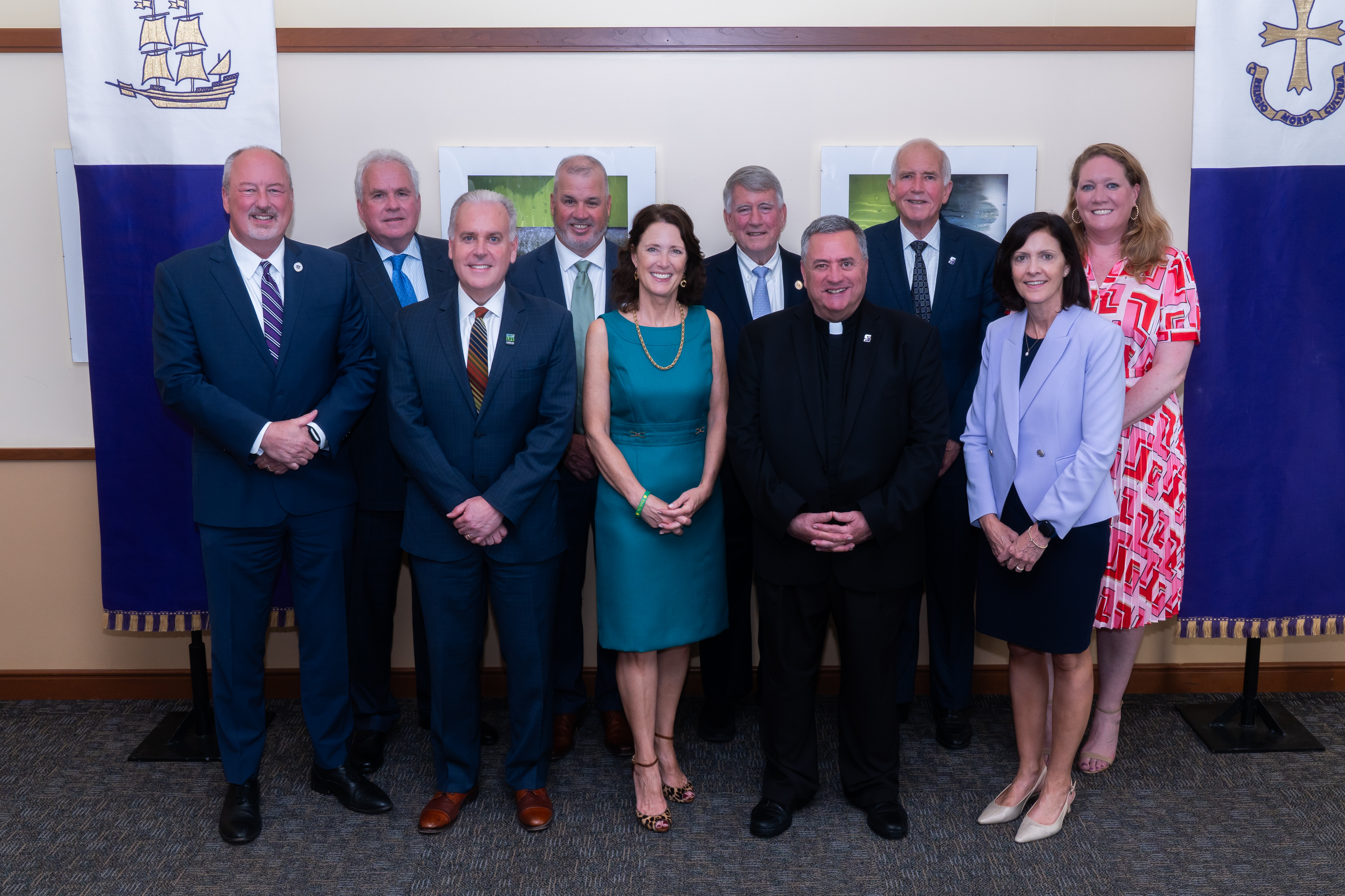 From left, Chris Neumann, Esq. '87, P'24, '26, Chair of the Alumni Society Advisory Board, Stephen Sandherr, J.D. '80, Matthew Cooper, M.D. '90, James Conmy '90, Kerry (Cosgrove) Conmy '90, Charles E. Carey, Esq. '75, Rev. Joseph G. Marina, S.J., University President, Kevin O'Brien, Esq. '80, Mary Frankoski Haveron, CPA '85 and Deirdre M. Walsh '00 enjoy a moment together at the 2025 O'Hara Awards ceremony.