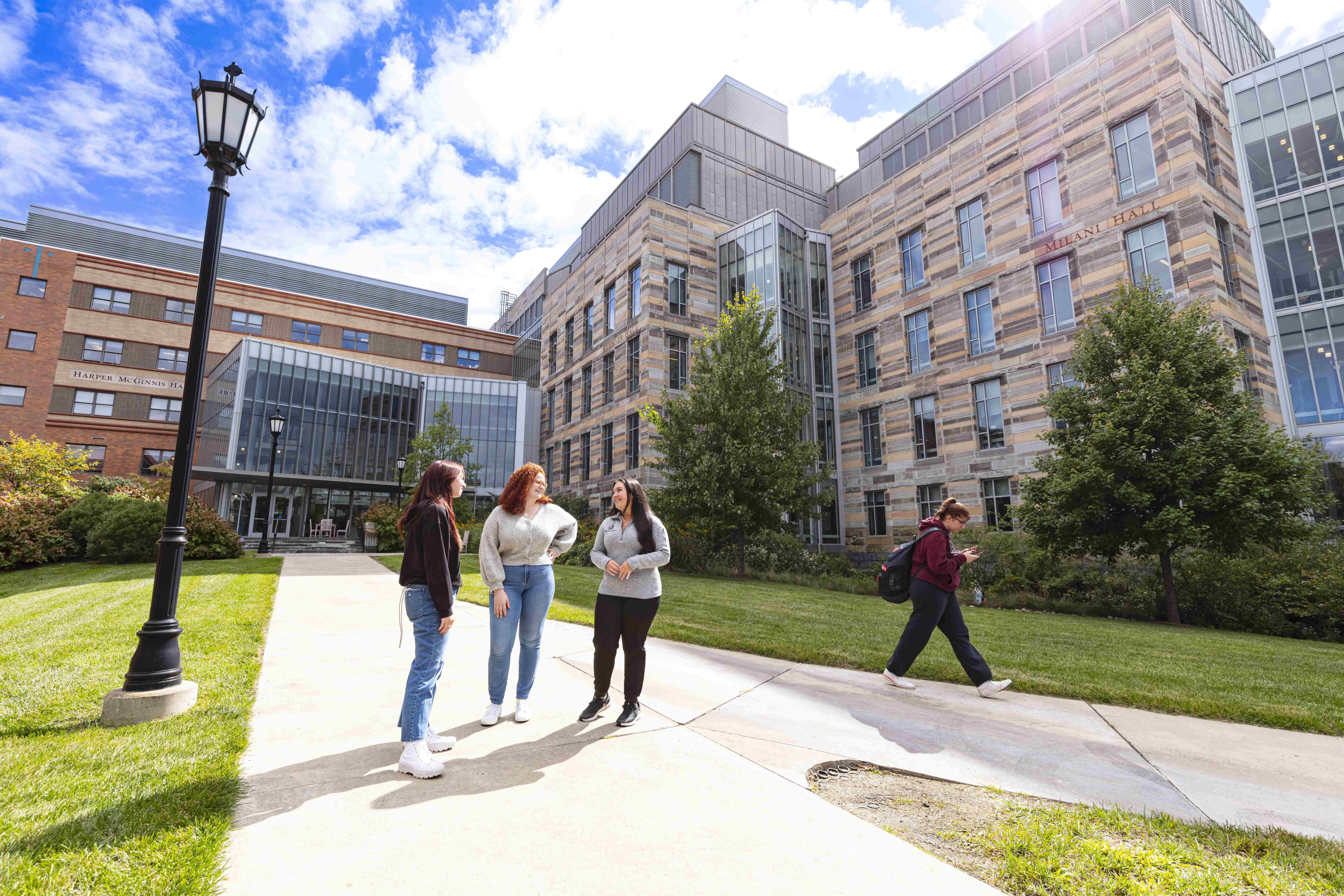 Students stand in front of the Loyola Science Center.