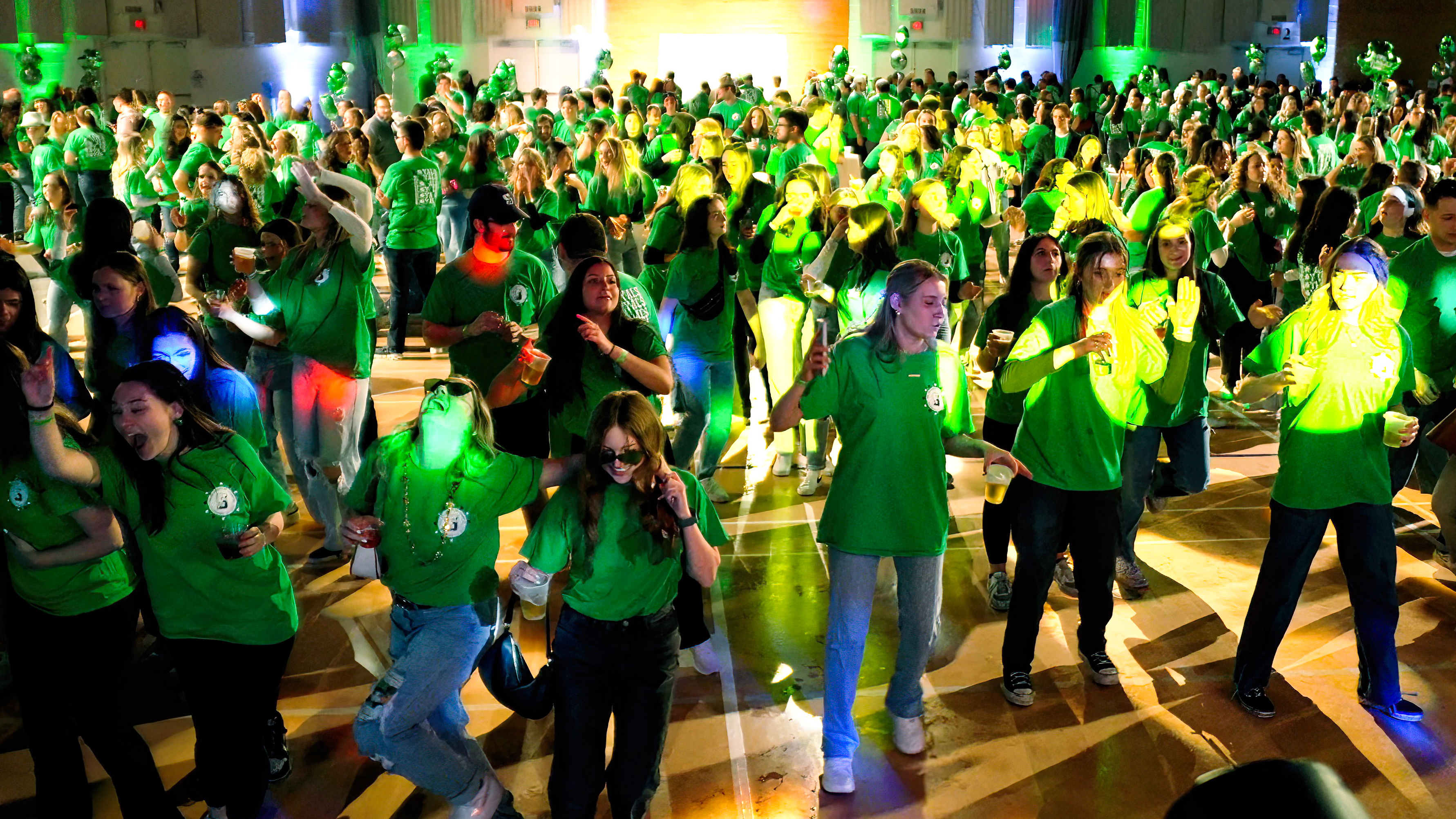 Attendees dance in the Byron Center at Shamrockin' Eve 2024.