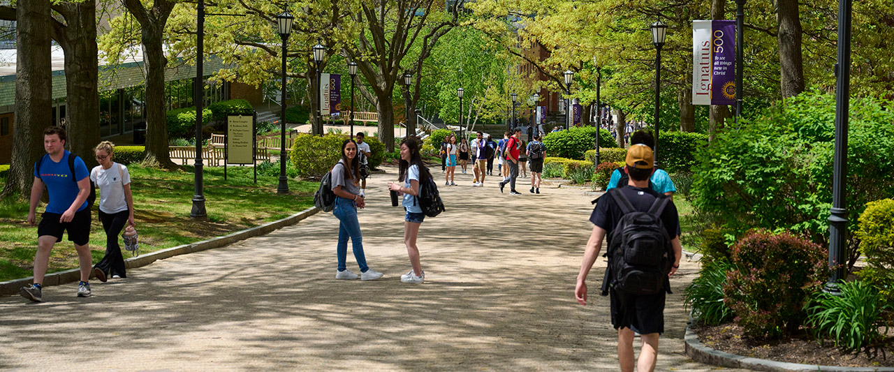 Students walking to and from class on the commons