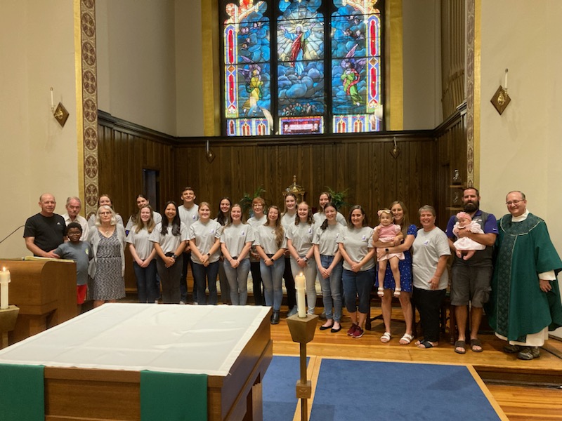 Catholic priest and worshippers at a Mass celebrated in American Sign Language
